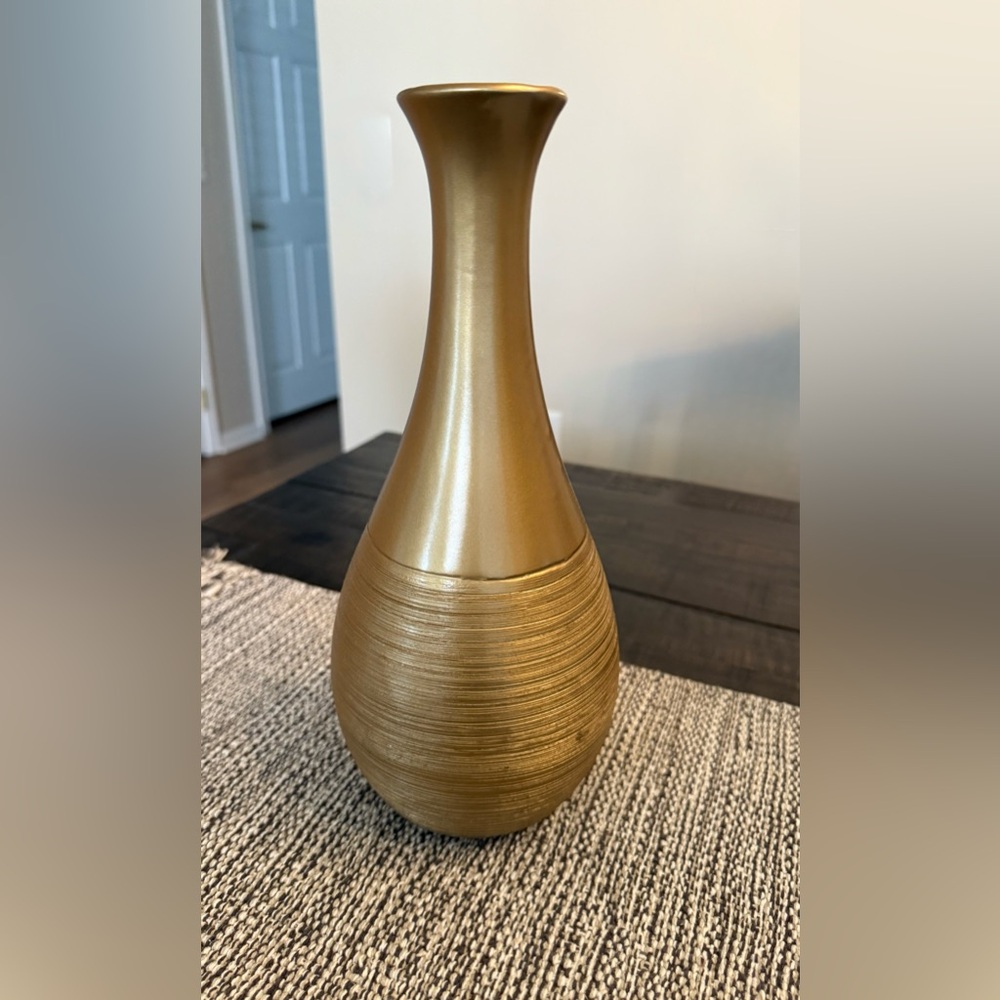 La Casa Bella gold decorative vase. Measures 12 1/2 inches tall x 6 inches wide